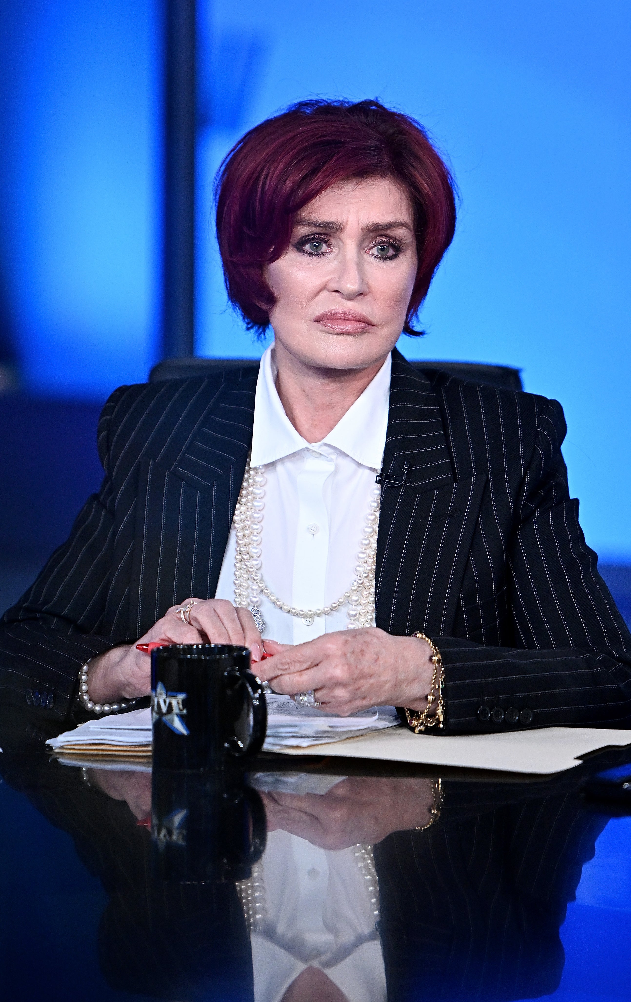 Close-up of Sharon sitting at a table