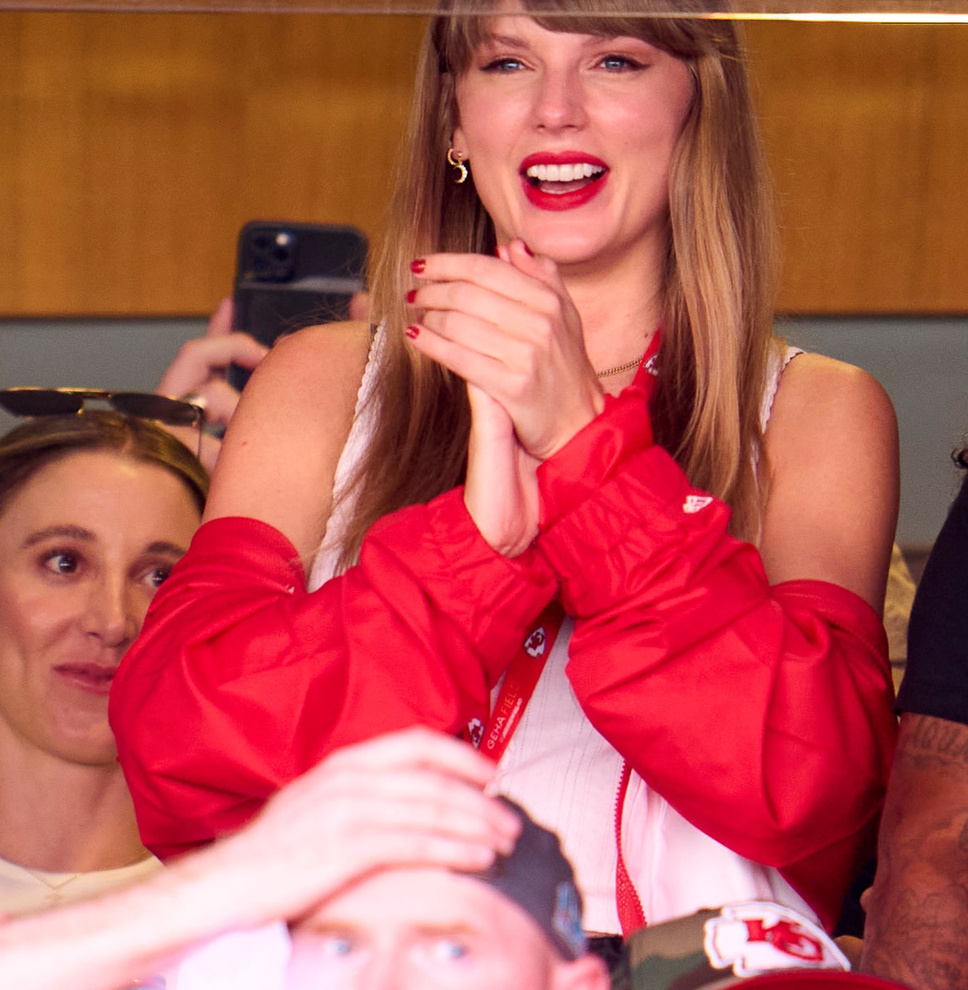 taylor smiling in the vip box