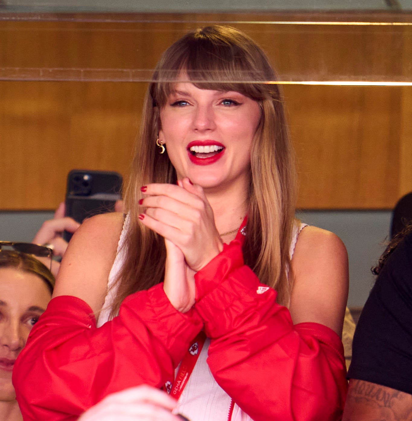 taylor smiling in the vip box