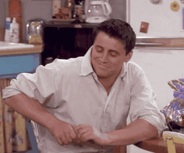 A gif of Joey from &quot;Friends&quot; going from happy and content to shocked