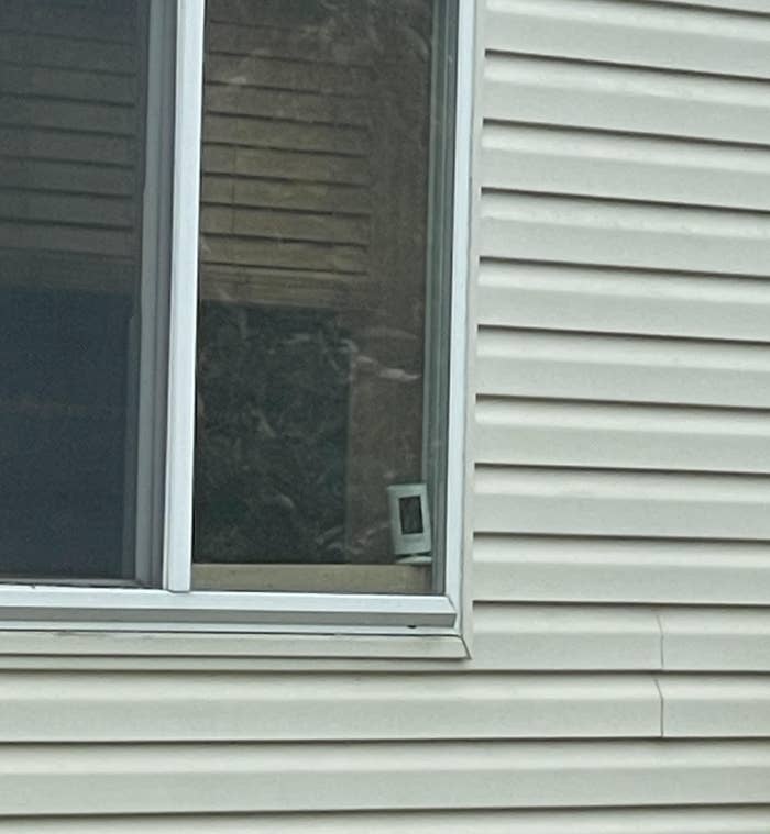 A window with a camera on it