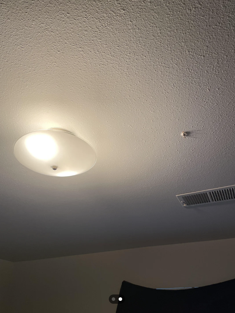 A bullet hole in the ceiling