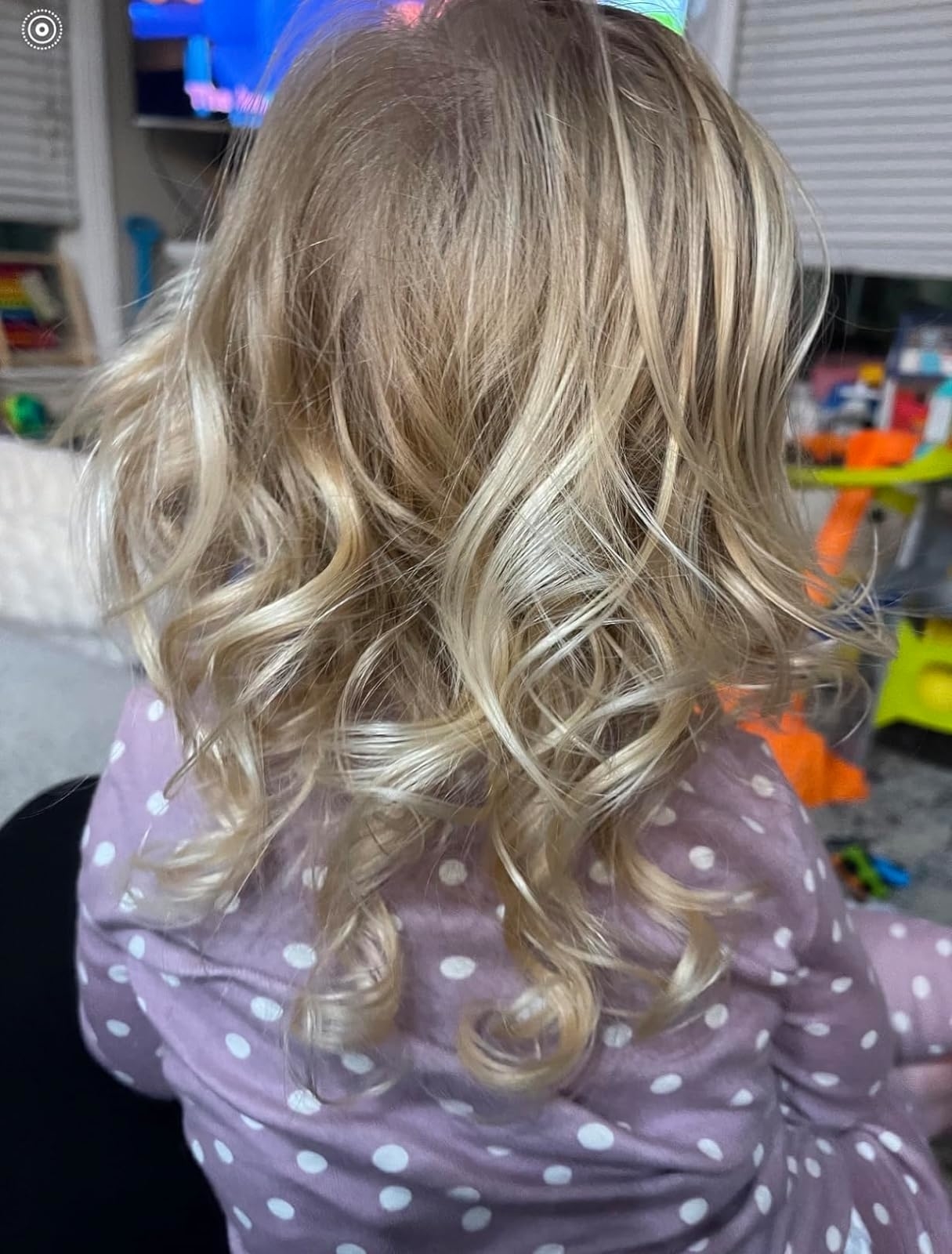 Reviewer’s photo of the back of their daughter’s curly hair