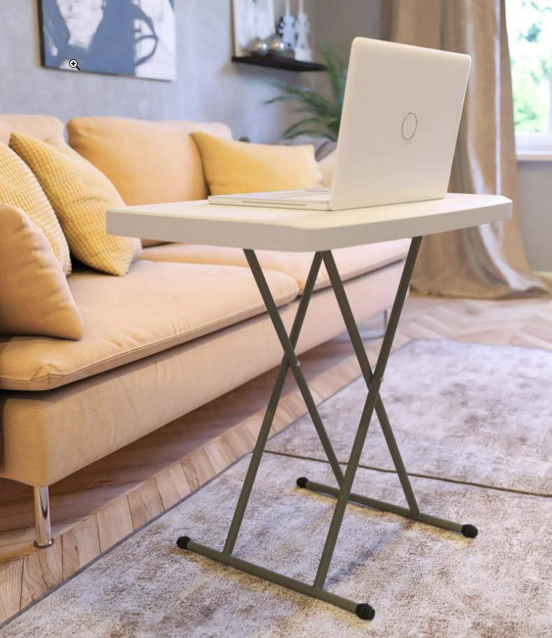 small white foldable table next to a couch