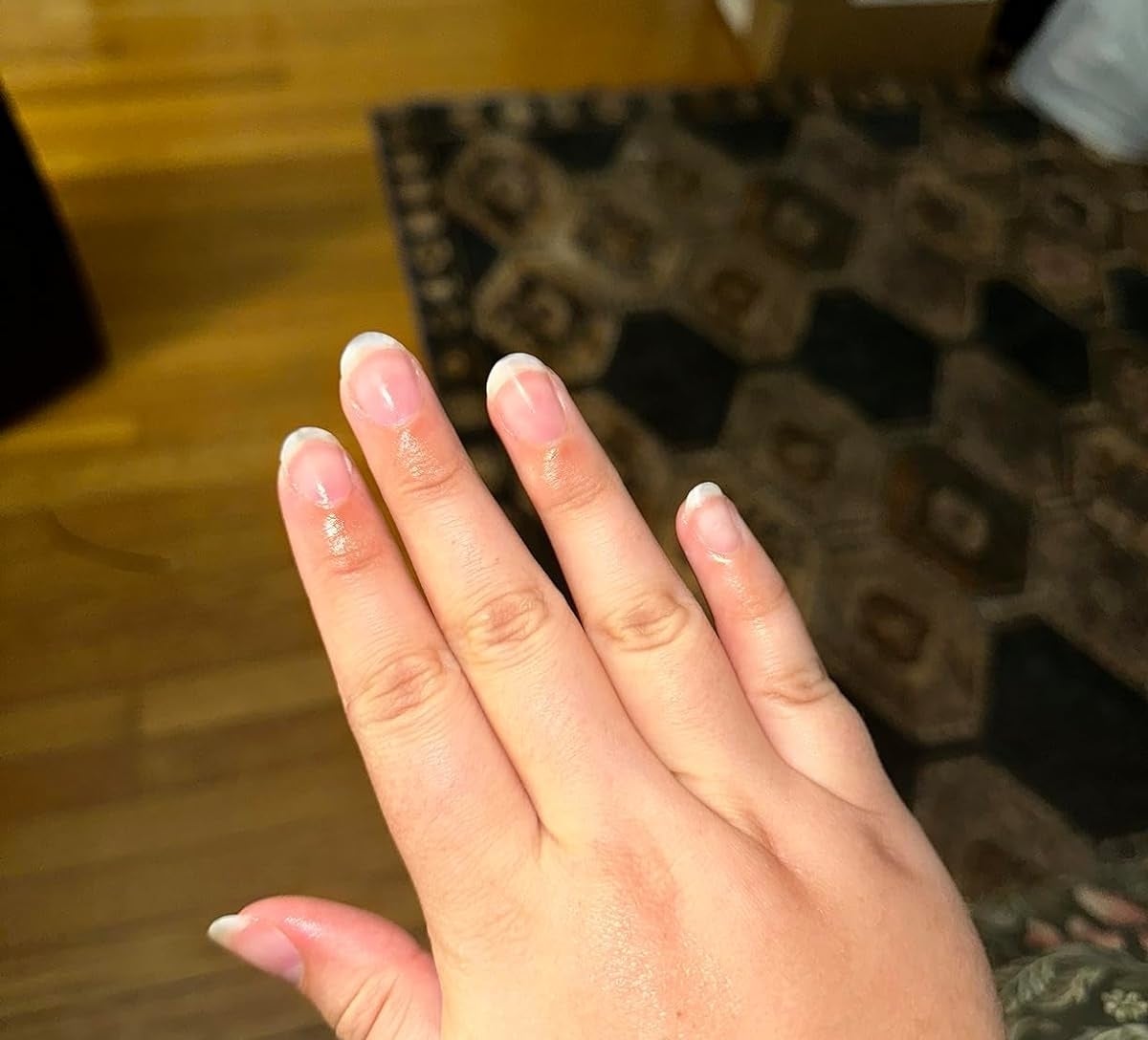 Reviewer’s photo of nails with cream on it