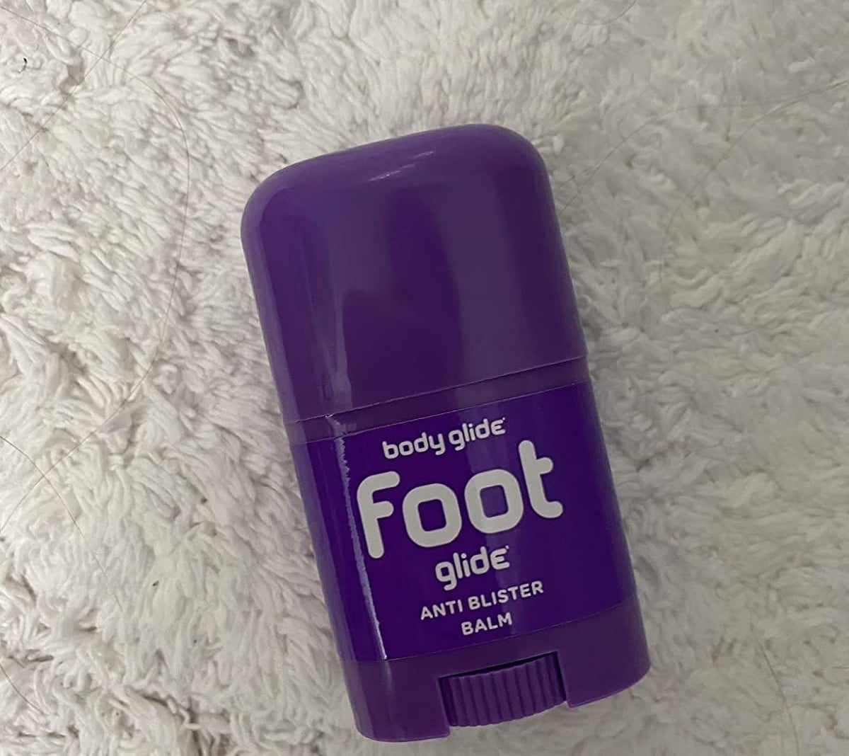 Reviewer’s photo of purple container of foot glide