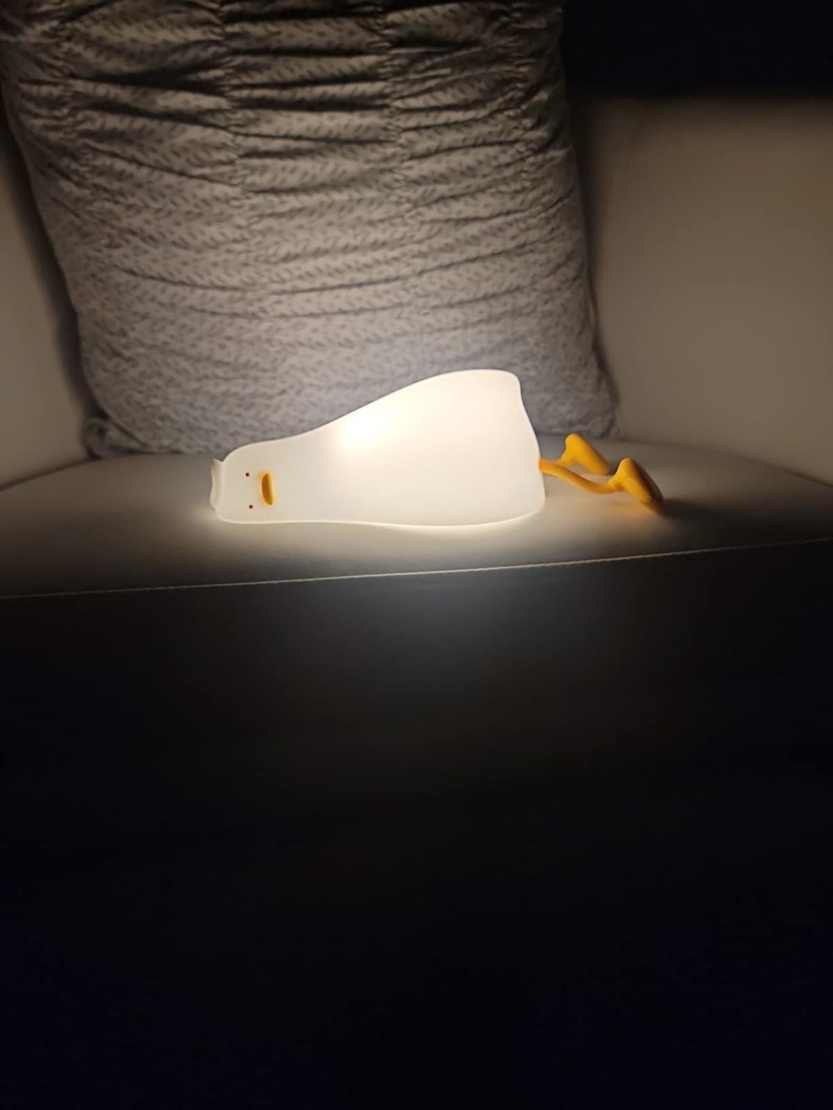 Reviewer image of the lit up duck night light on an armchair