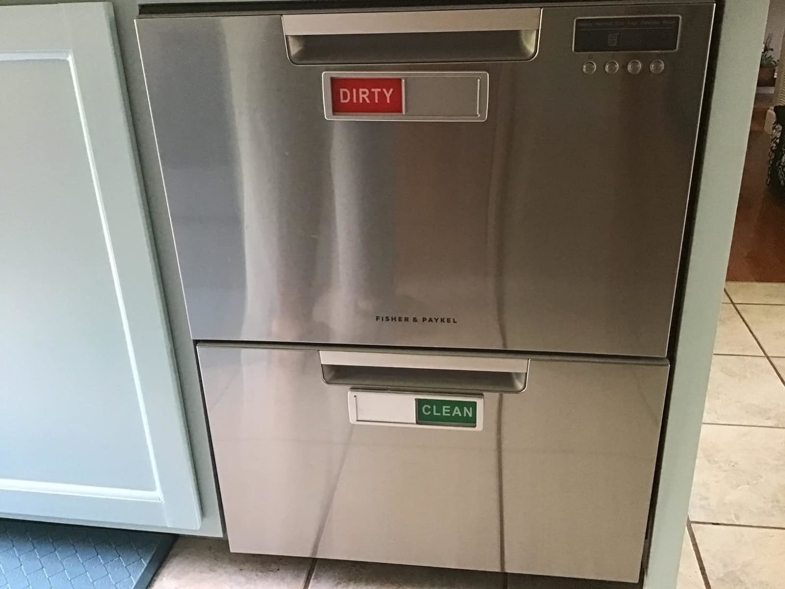 Reviewer’s photo of double dishwasher with red dirty magnet and green clean magnet