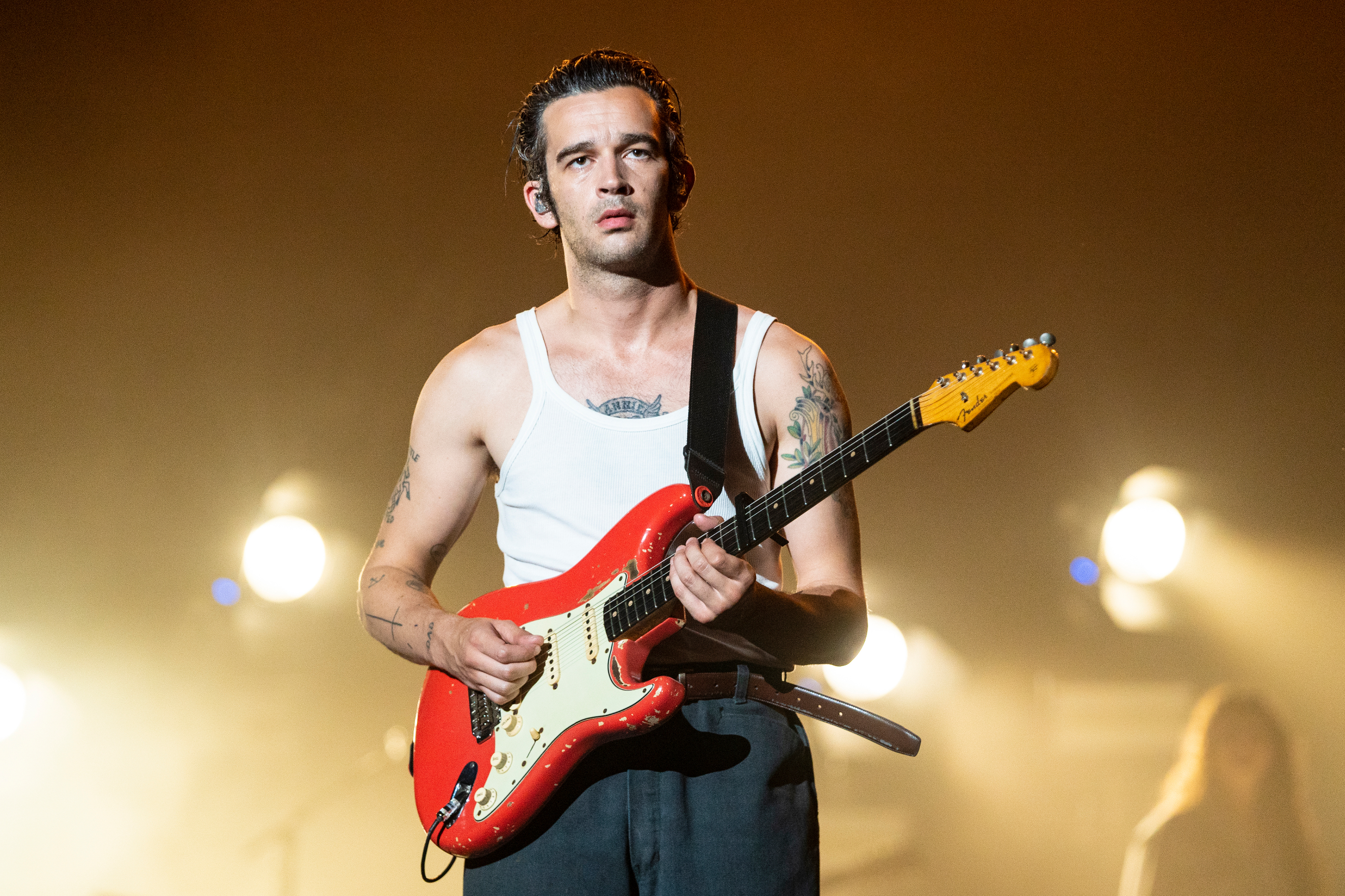 matty playing guitar on stage