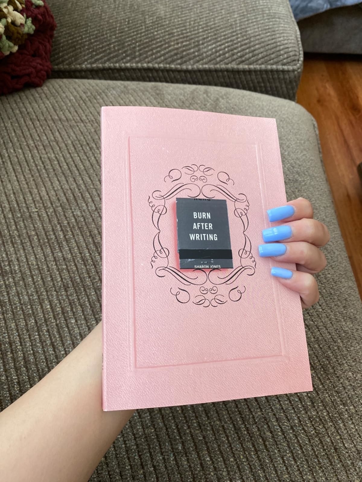 Reviewer holding the pink book