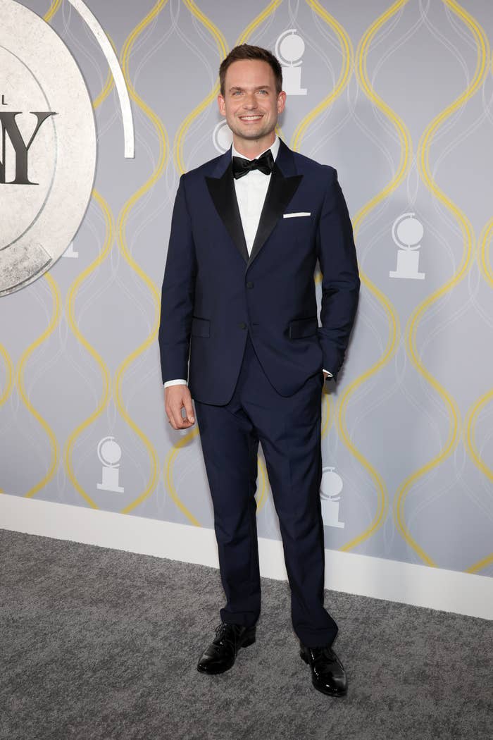 Closeup of Patrick J. Adams in a tux on the red carpet