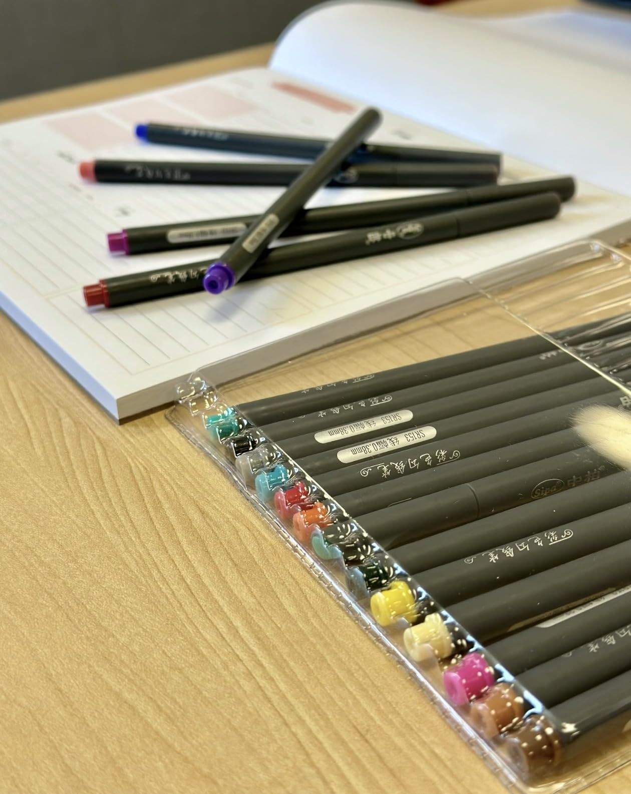 Reviewer image of the pens and a notebook