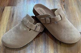 a reviewer photo of suede clogs 