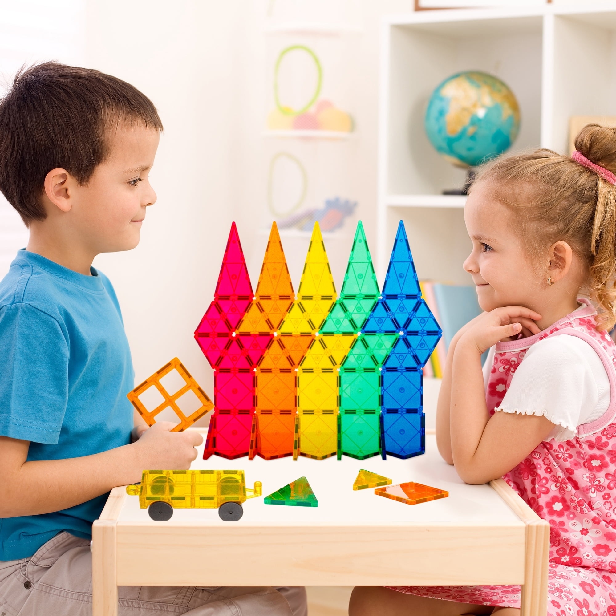 Kids play with magnetic tiles