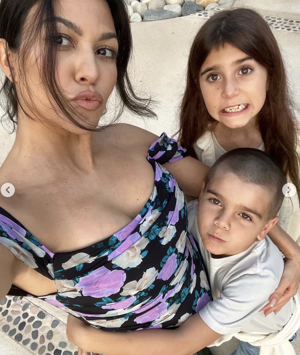Close-up of Kourtney with two of her children