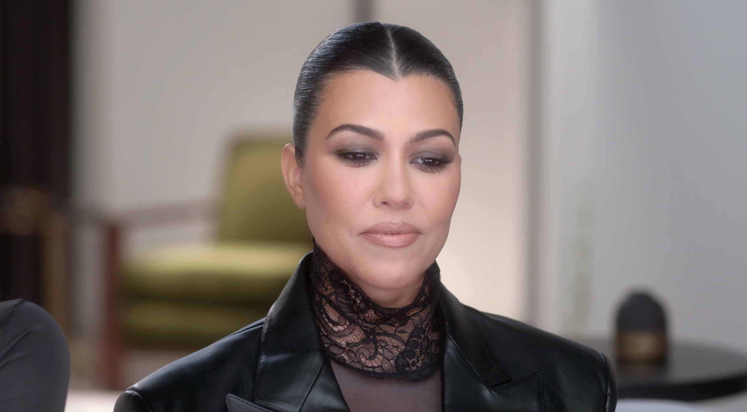 closeup of kourtney looking uncomfortable