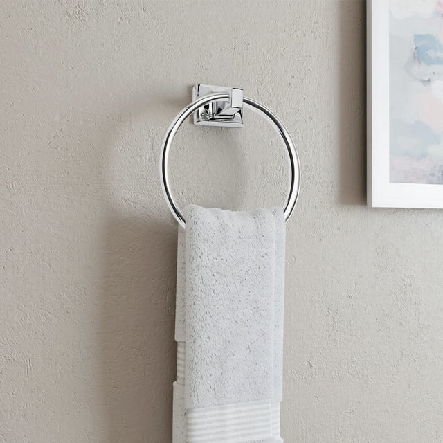 silver towel ring with a white towel hanging