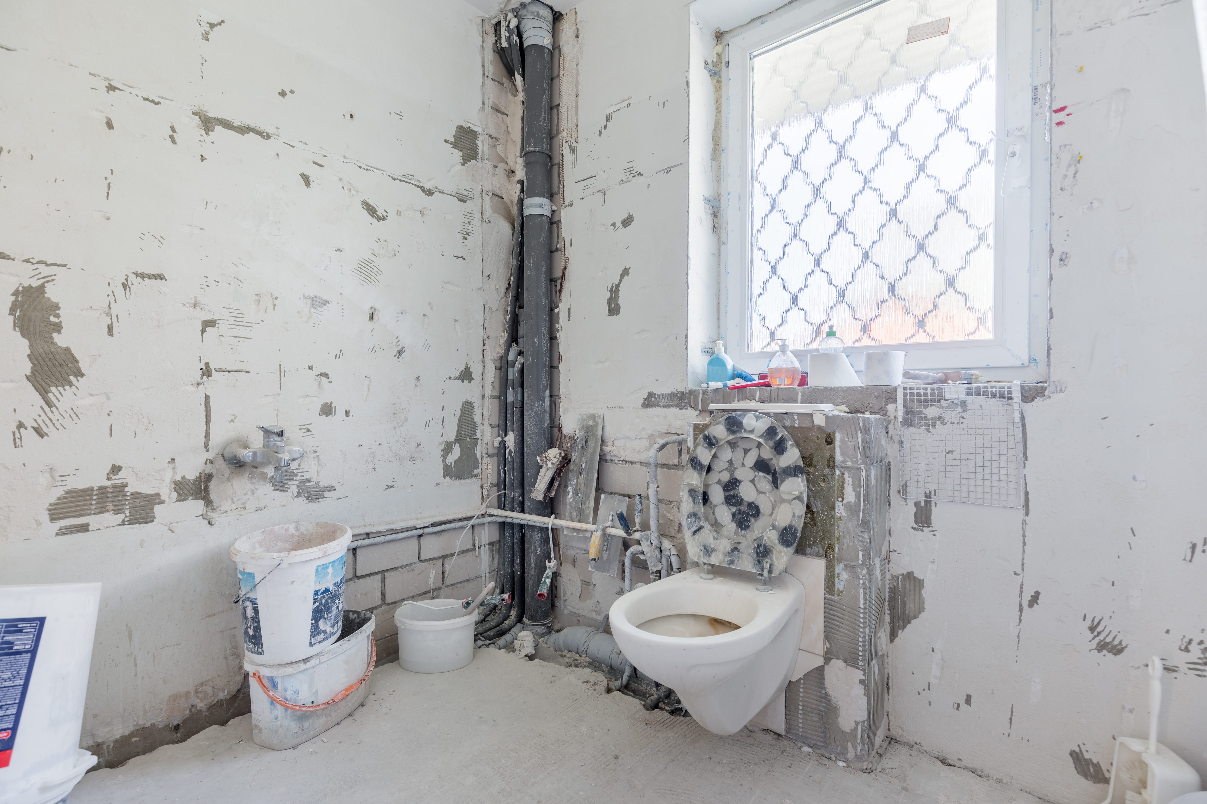 torn up and demolished bathroom before being renovated