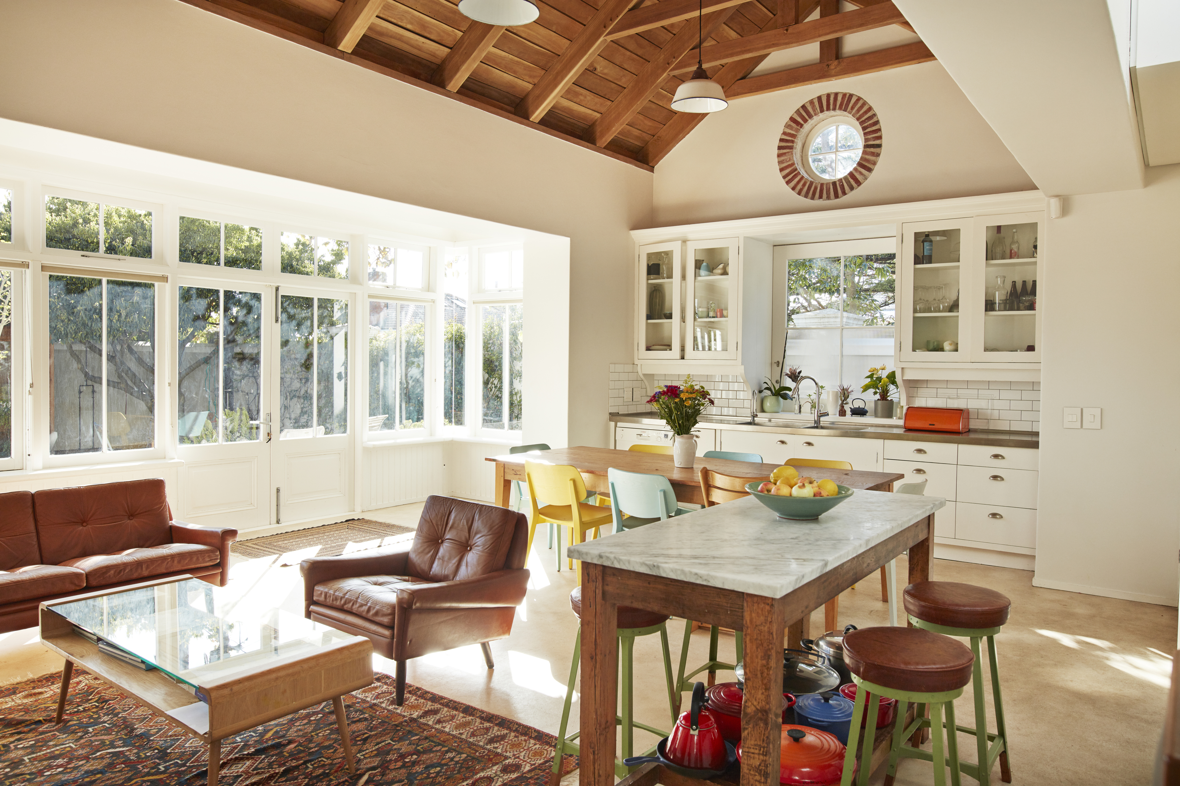 vaulted wood ceiling in a kitchen and living room area