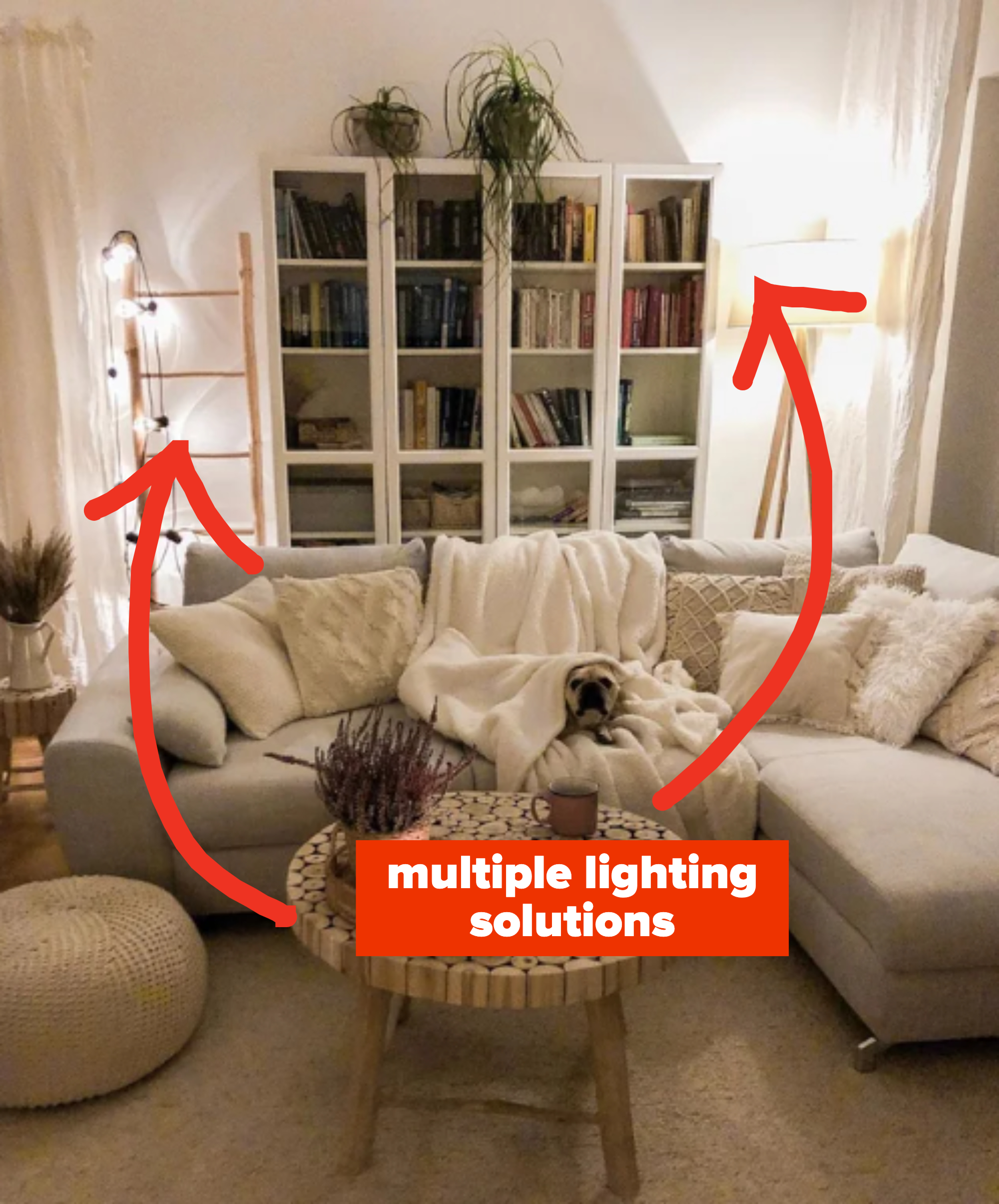 hanging string lights on a wooden ladder and a tripod floor lamp in a living room
