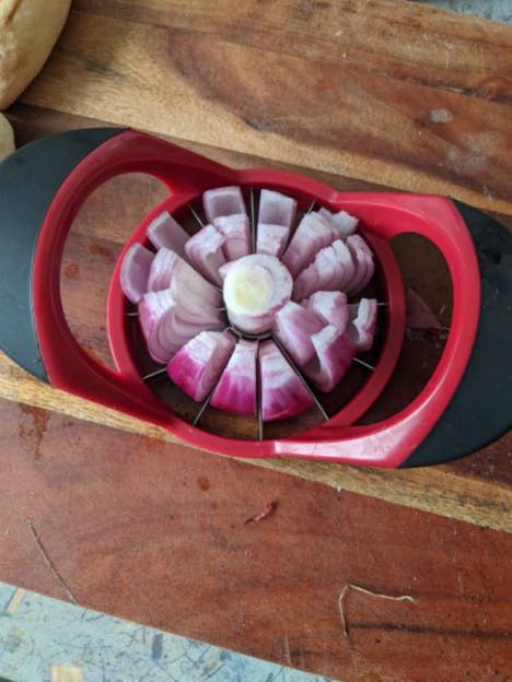 slicing an onion with an apple corer