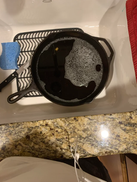 cast iron skillet with soap inside it