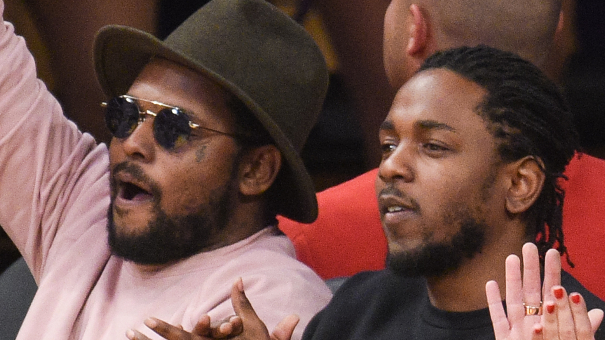 Kendrick Lamar and Schoolboy Q hopped on the field after Rams camp