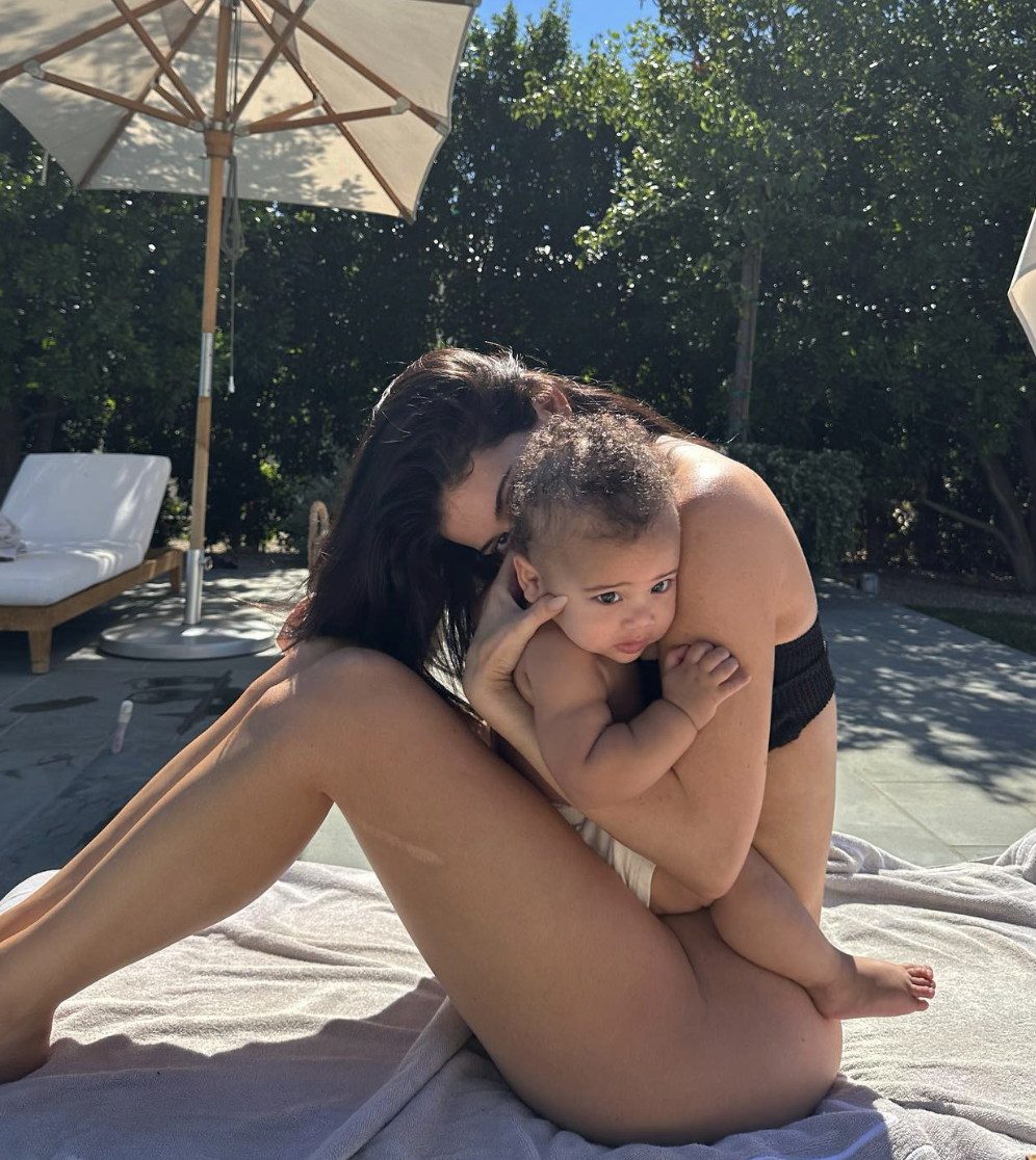 kylie and her son by the pool