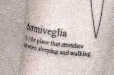 closeup of the tattoo with the word walking