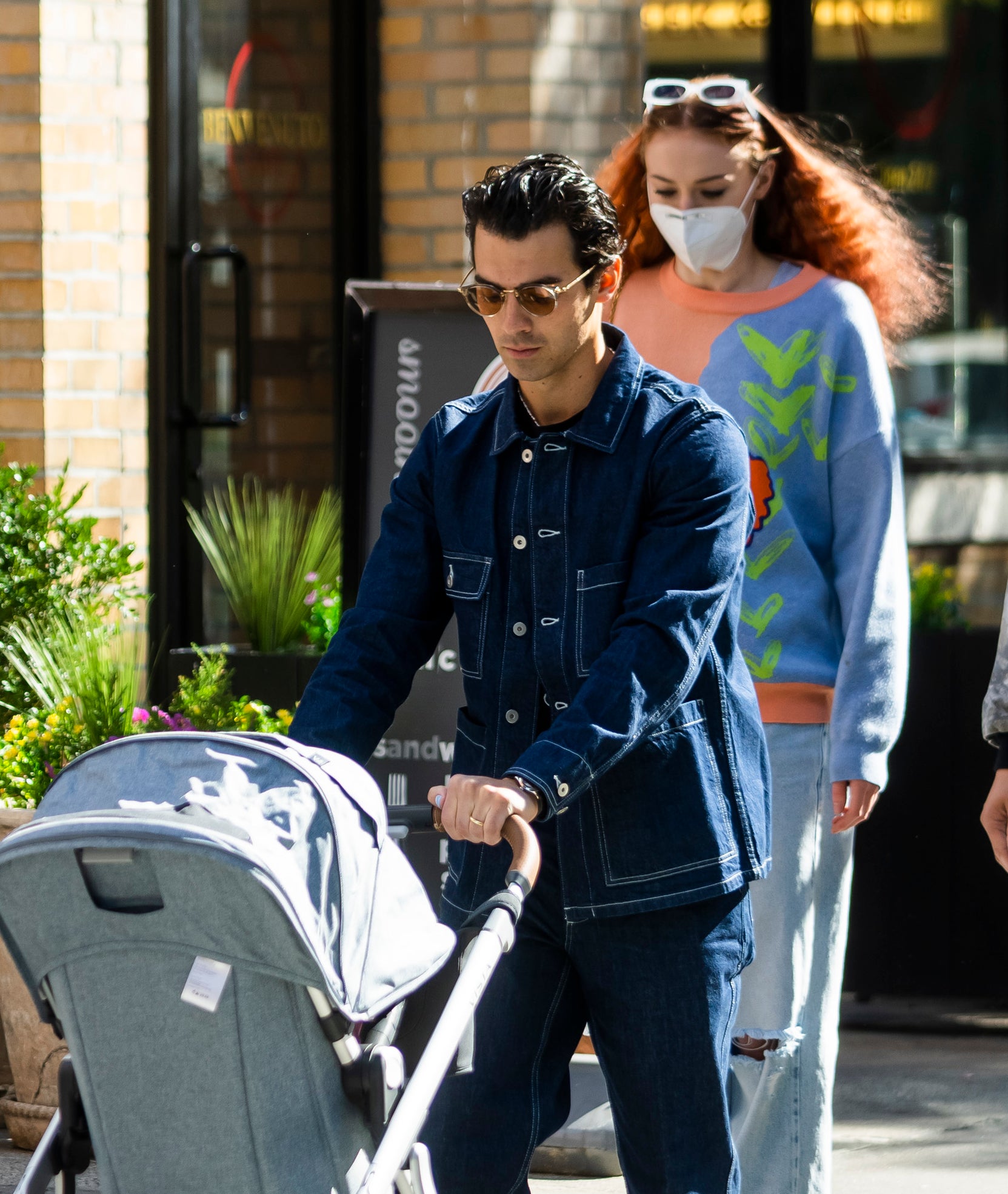 joe pushing the stroller as sophie walks right behind him