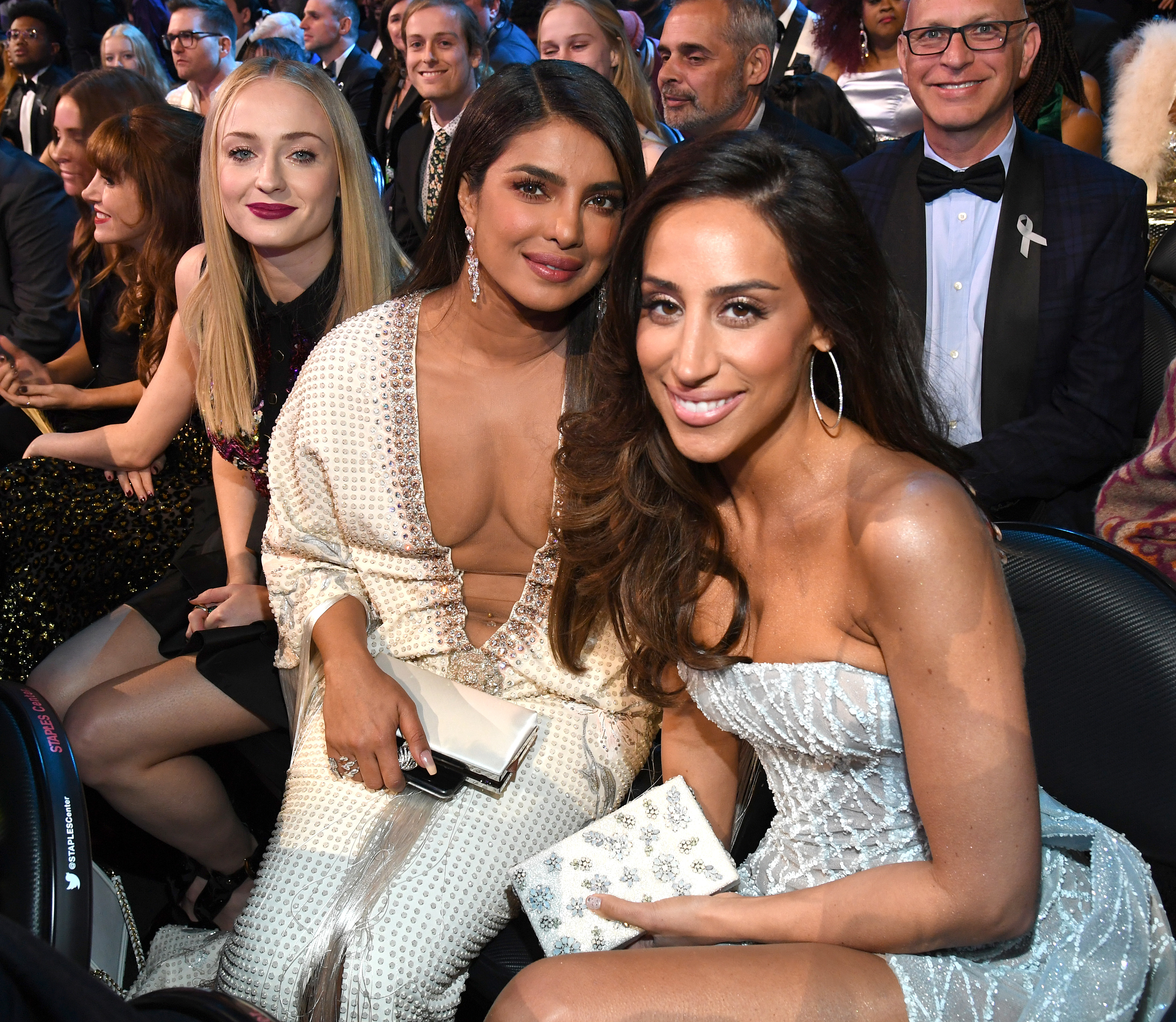 sophie, danielle, and priyanka sitting in the auditorium