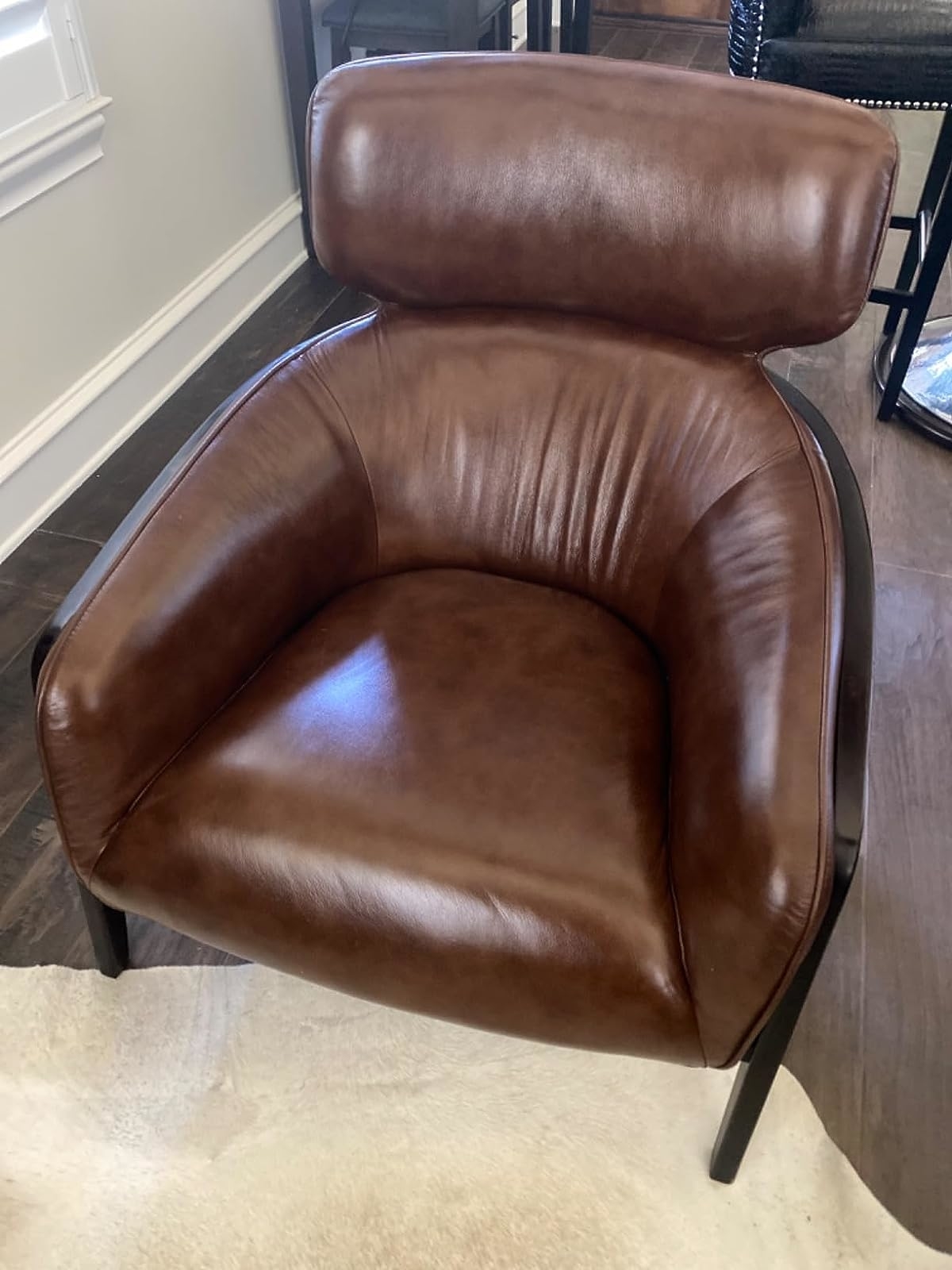 Reviewer image of their leather chair treated with the conditioner