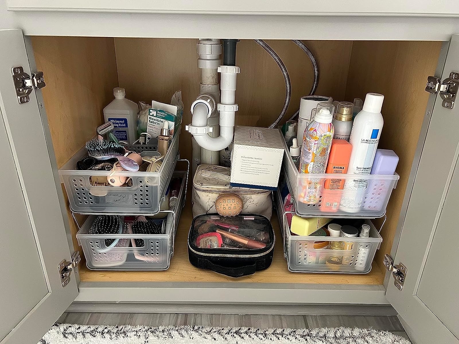 Reviewer image of the two organizer used inside a bathroom vanity