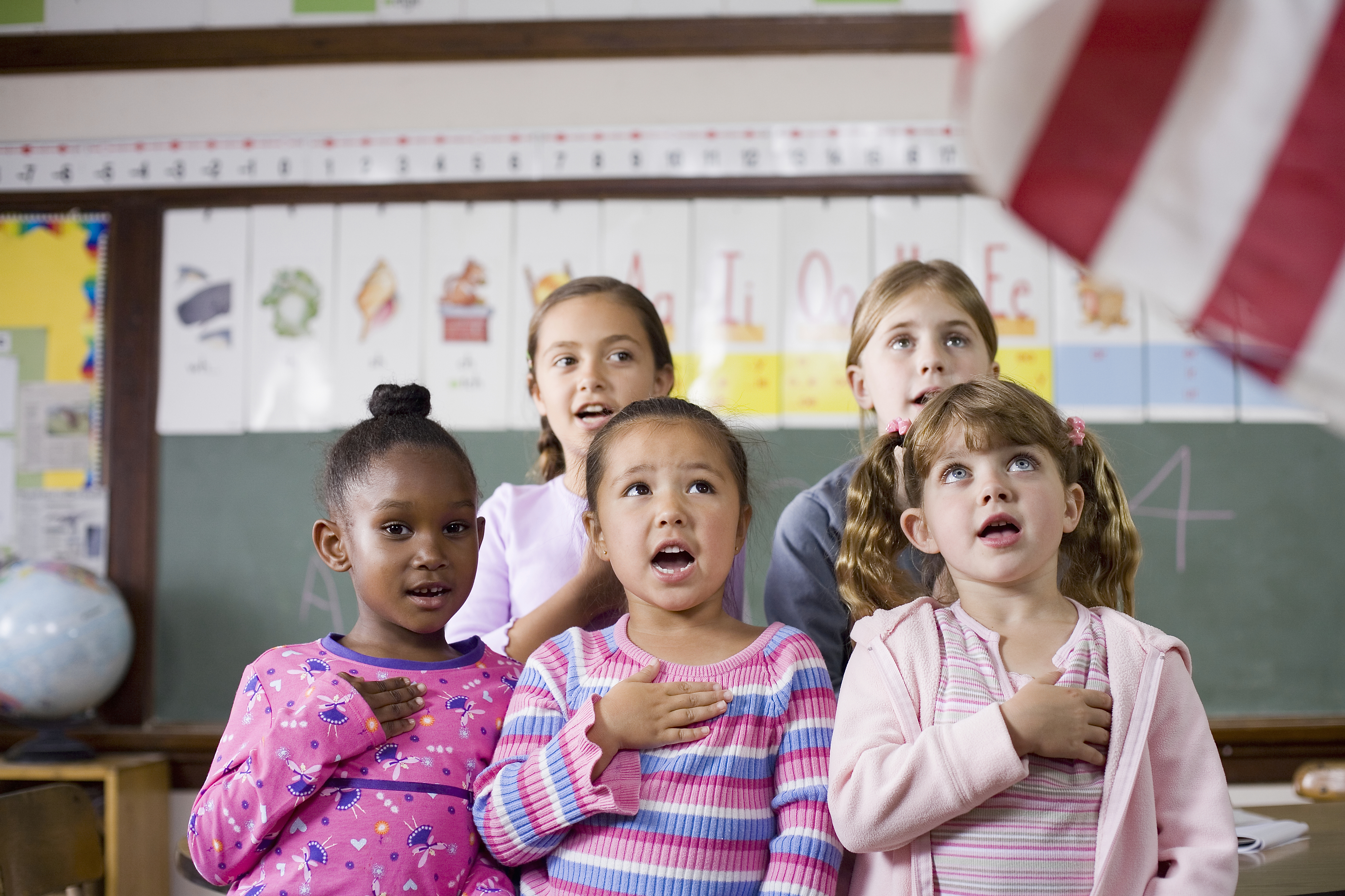 little kids saying the pledge of allegiance at school