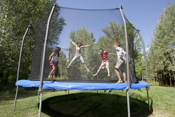 kids jumping on a trampoline