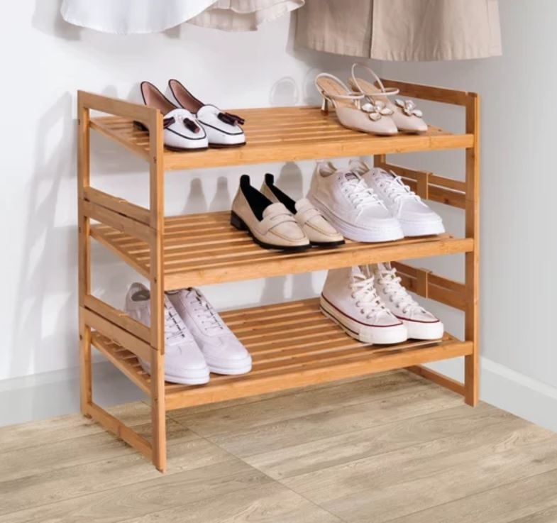 three-tier bamboo shoe rack with sneakers, loafers and heels stored