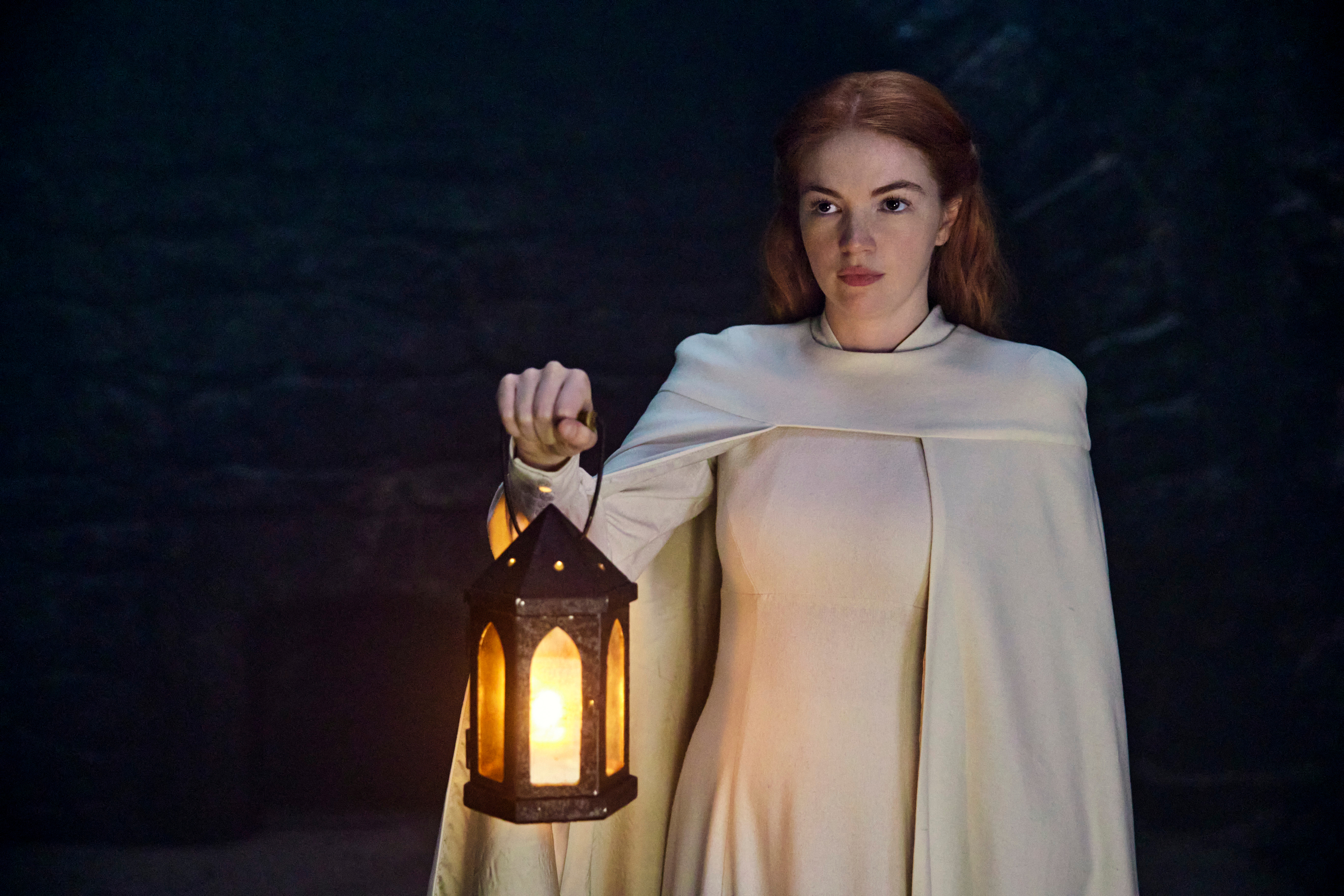 Elayne holds a lantern