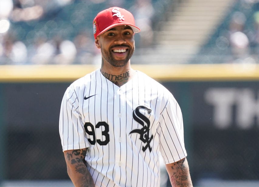 Vic Mensa ini a Sox baseball jersey smiling