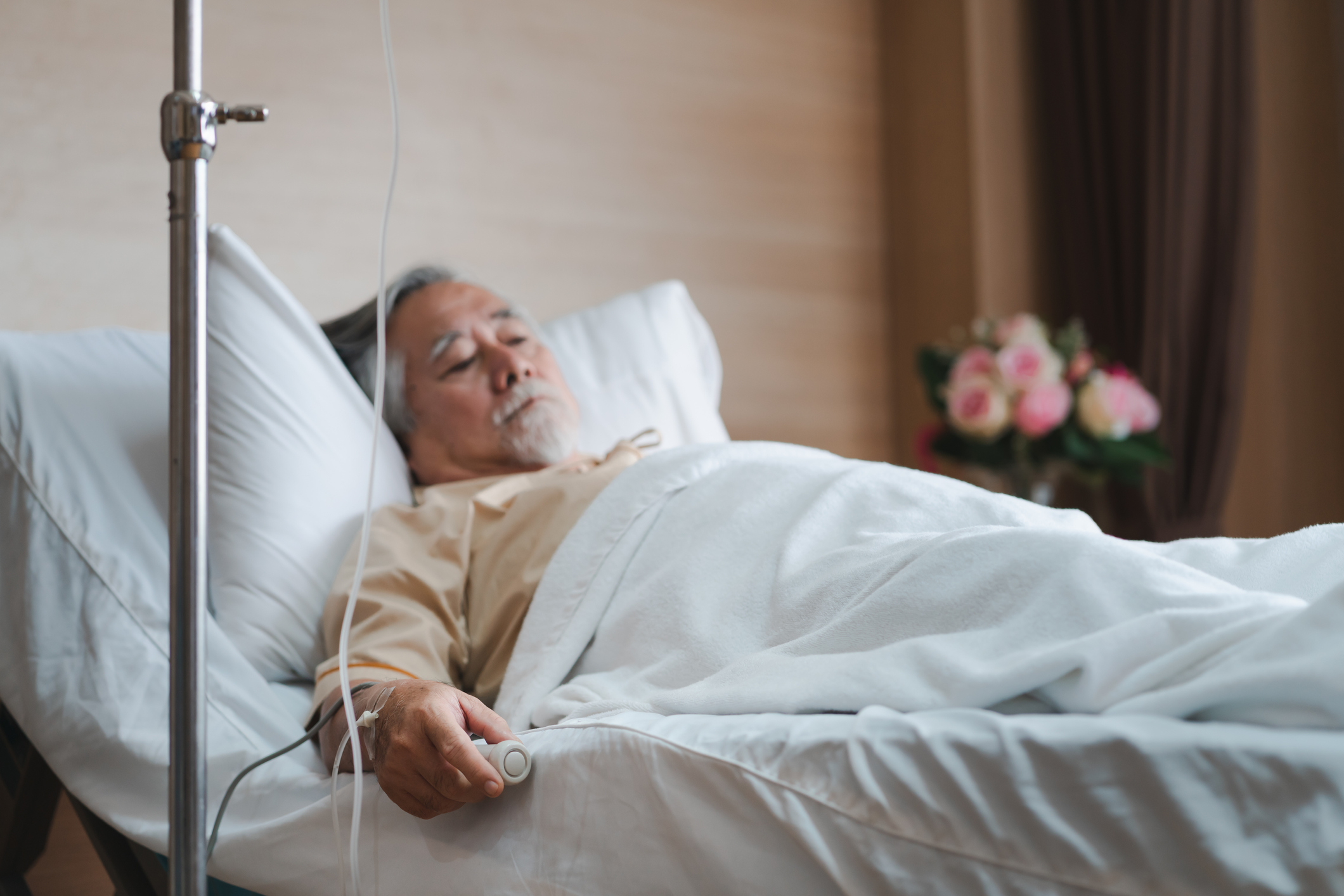 A man lying in a hospital bed