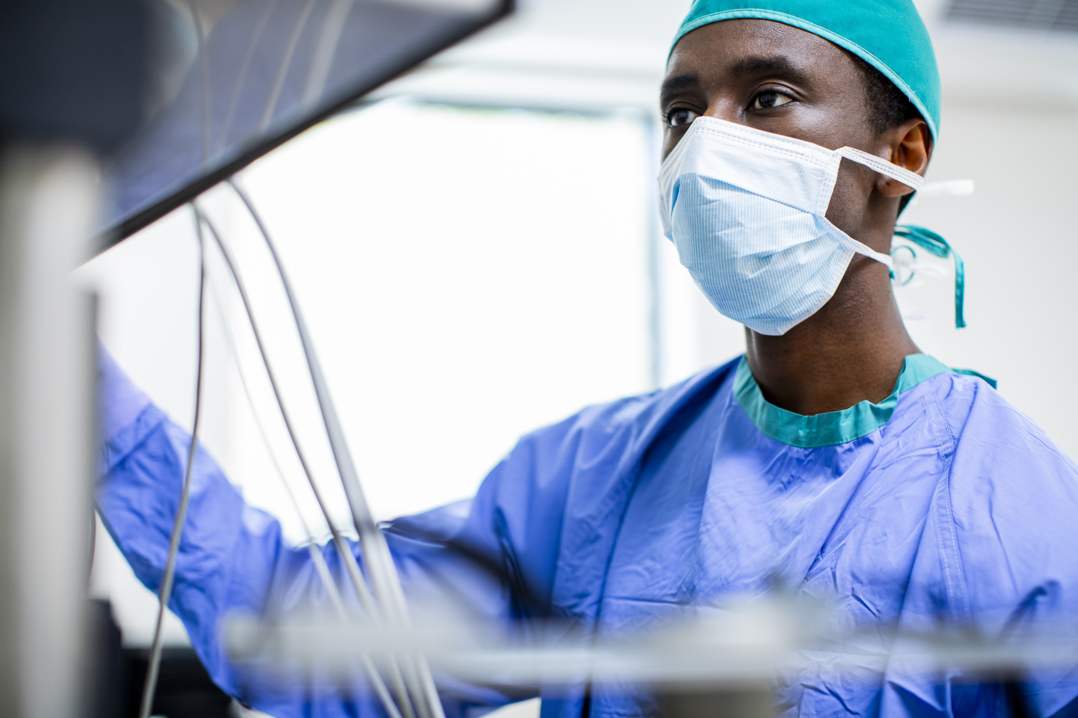 A doctor looking at a machine