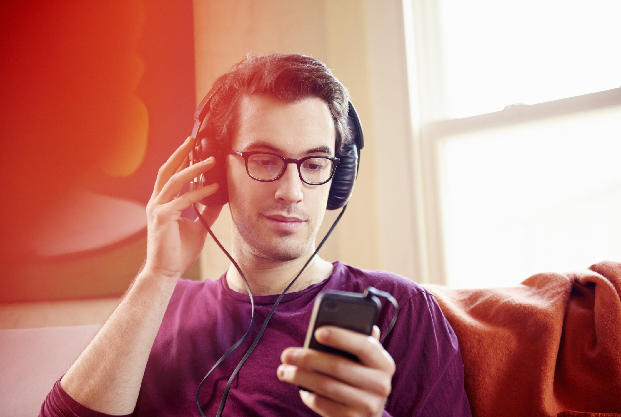 A man listening to music on his headphones