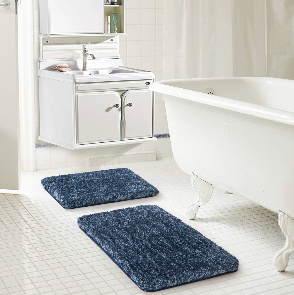two dark soft blue bathroom floor mats
