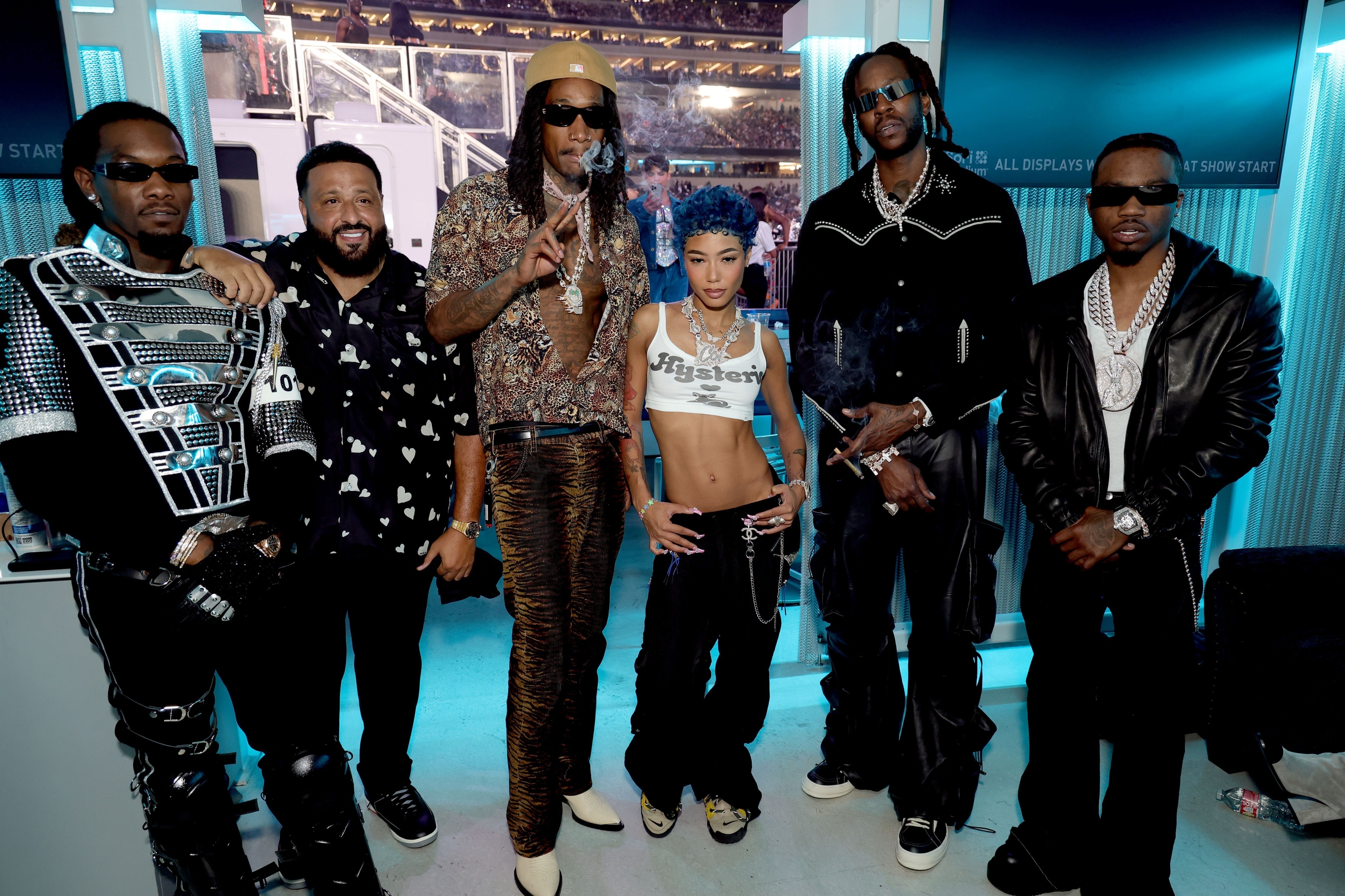 Coi Leray posing with others including Offset, DJ Khaled, and Wiz Kalifa