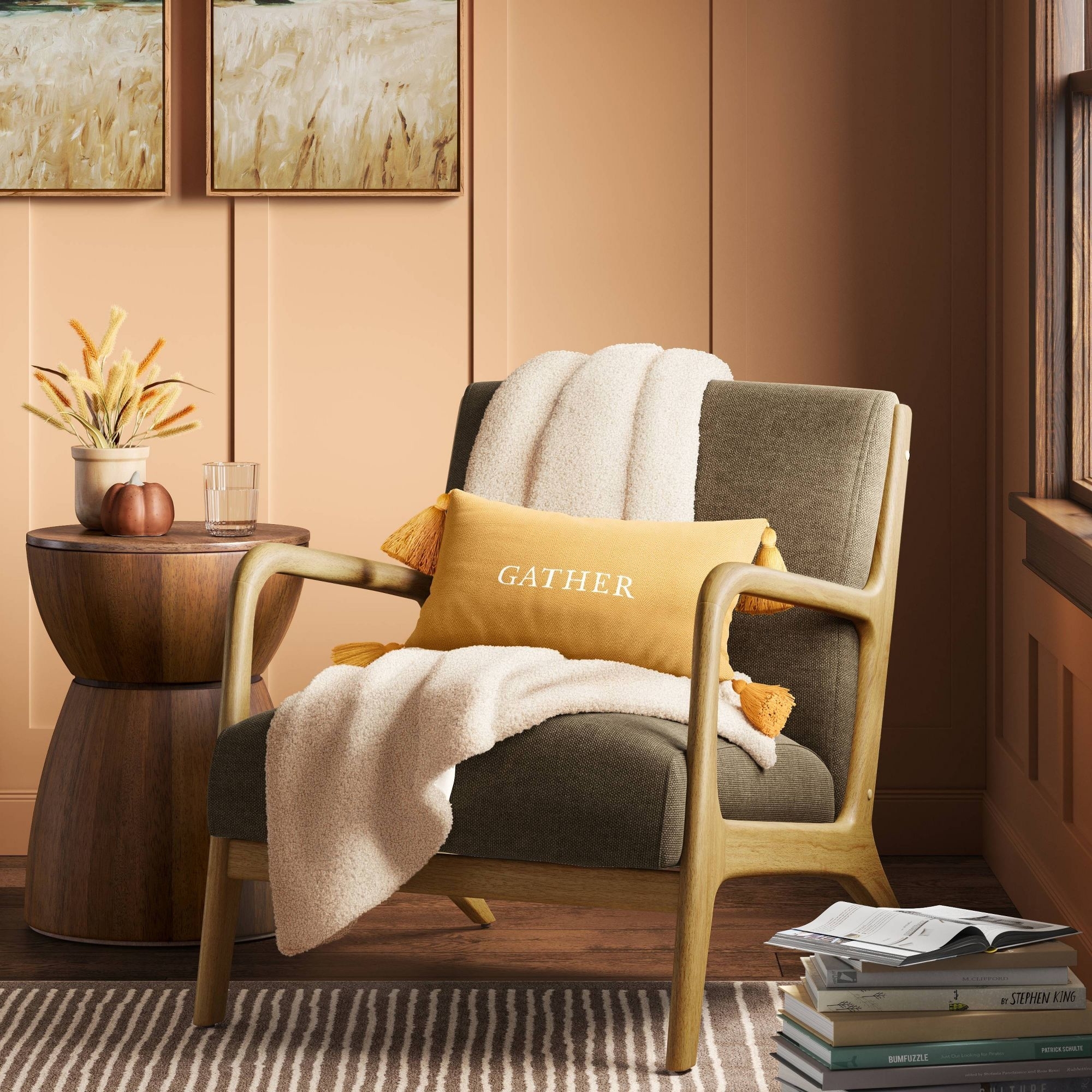 The throw in cream draped over an armchair