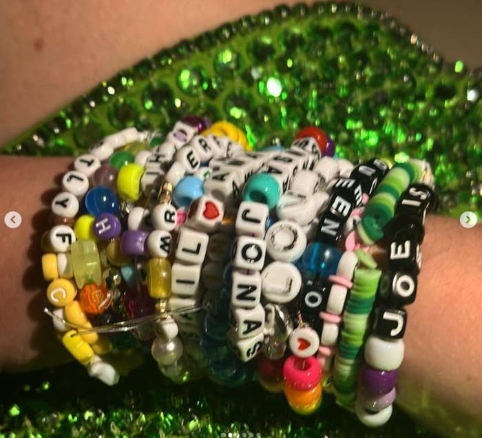 An armful of bracelets with Joe&#x27;s name on multiple