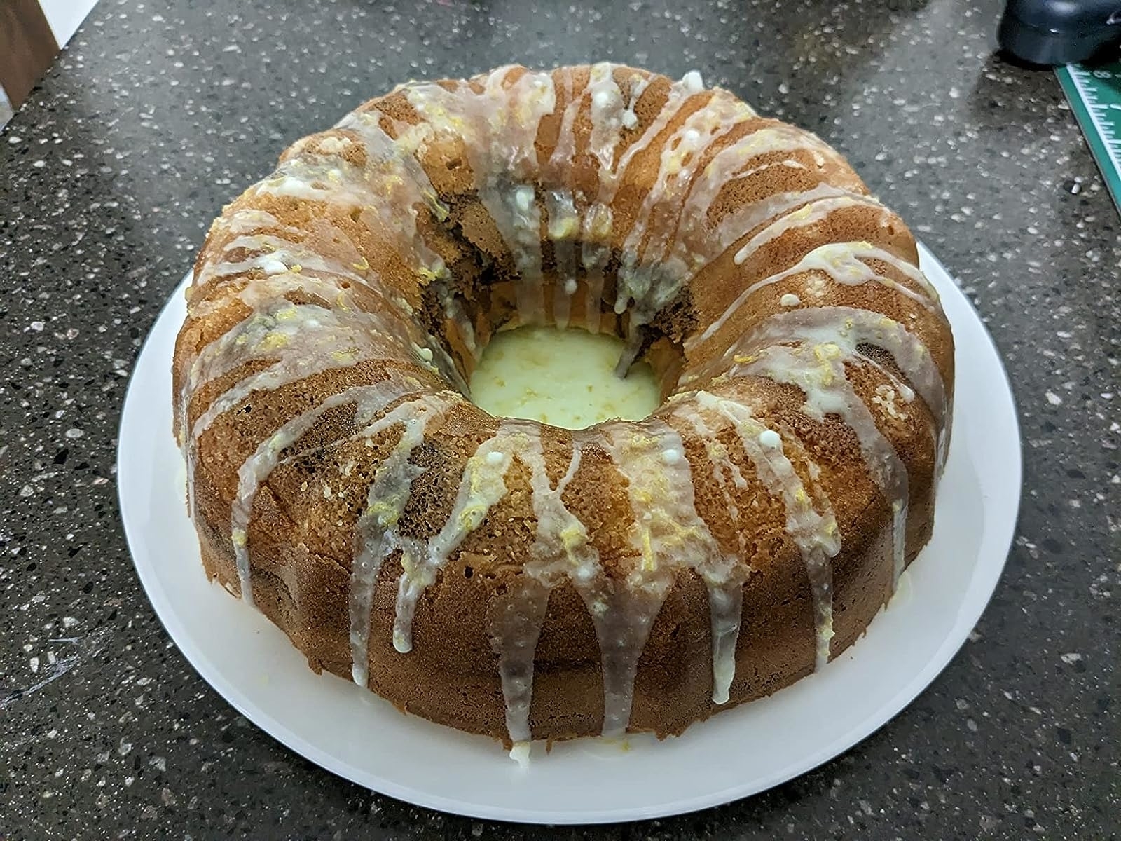 Reviewer image of their baked bundt cake with icing on it