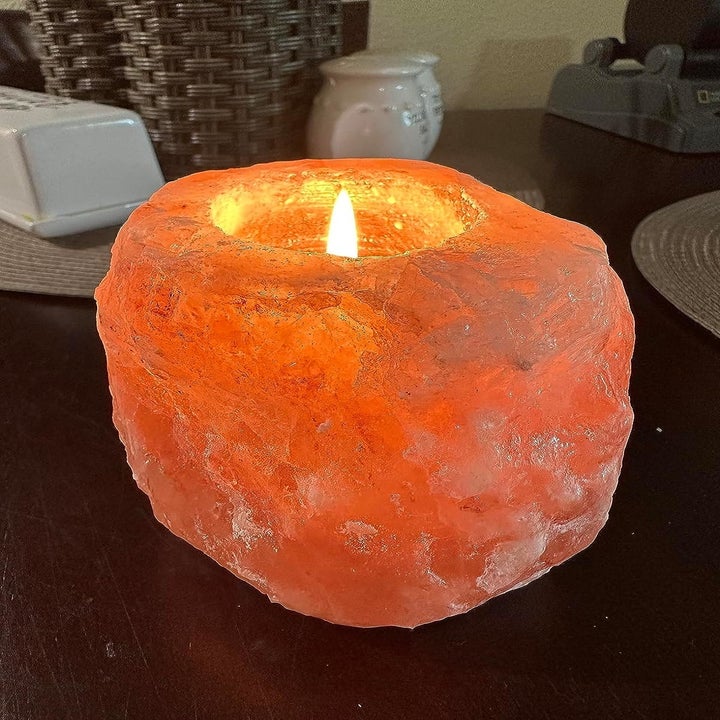 a tea light lit inside the salt candle