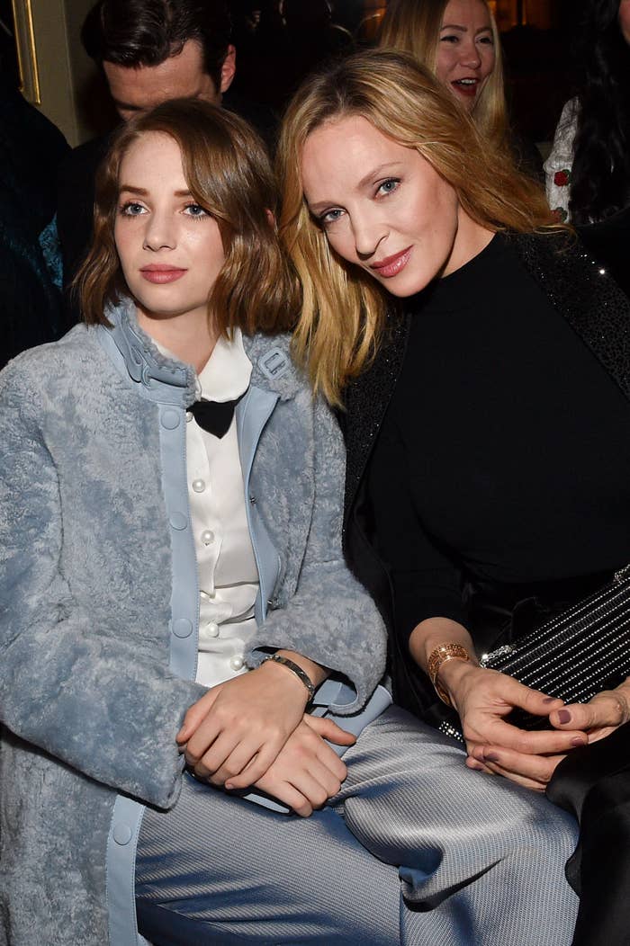 Closeup of Maya Hawke and Uma Thurman sitting at an event