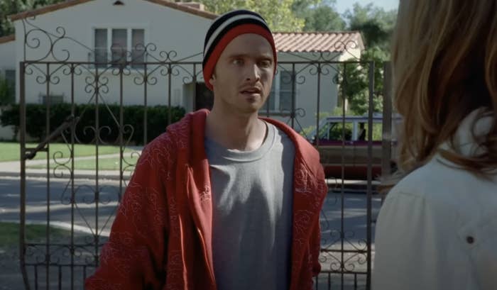 Jesse Pinkman talking to someone outside