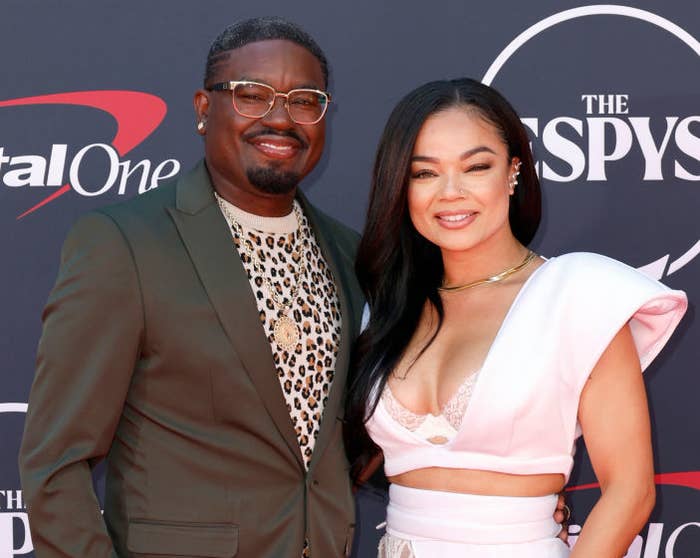A closeup of Lil Rel and Dannella smiling for photographers on the red carpet at The Espys